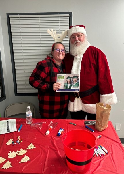 Santa visits Excel Center staff.