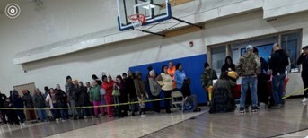 Participants waiting in line to speak with Ivy Tech and HACR staff and then receive their meal kits.