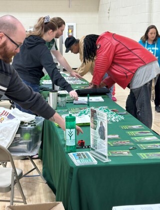 A resident working with Ivy Tech staff to submit interest forms for Spring 2024 courses