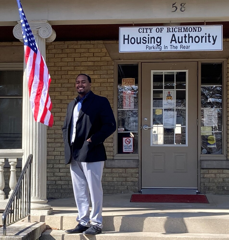 Keon Jackson standing in front of the City of Richmond Housing Authority Building