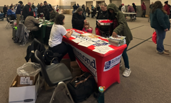 Various individuals attending the Turkey Giveaway.